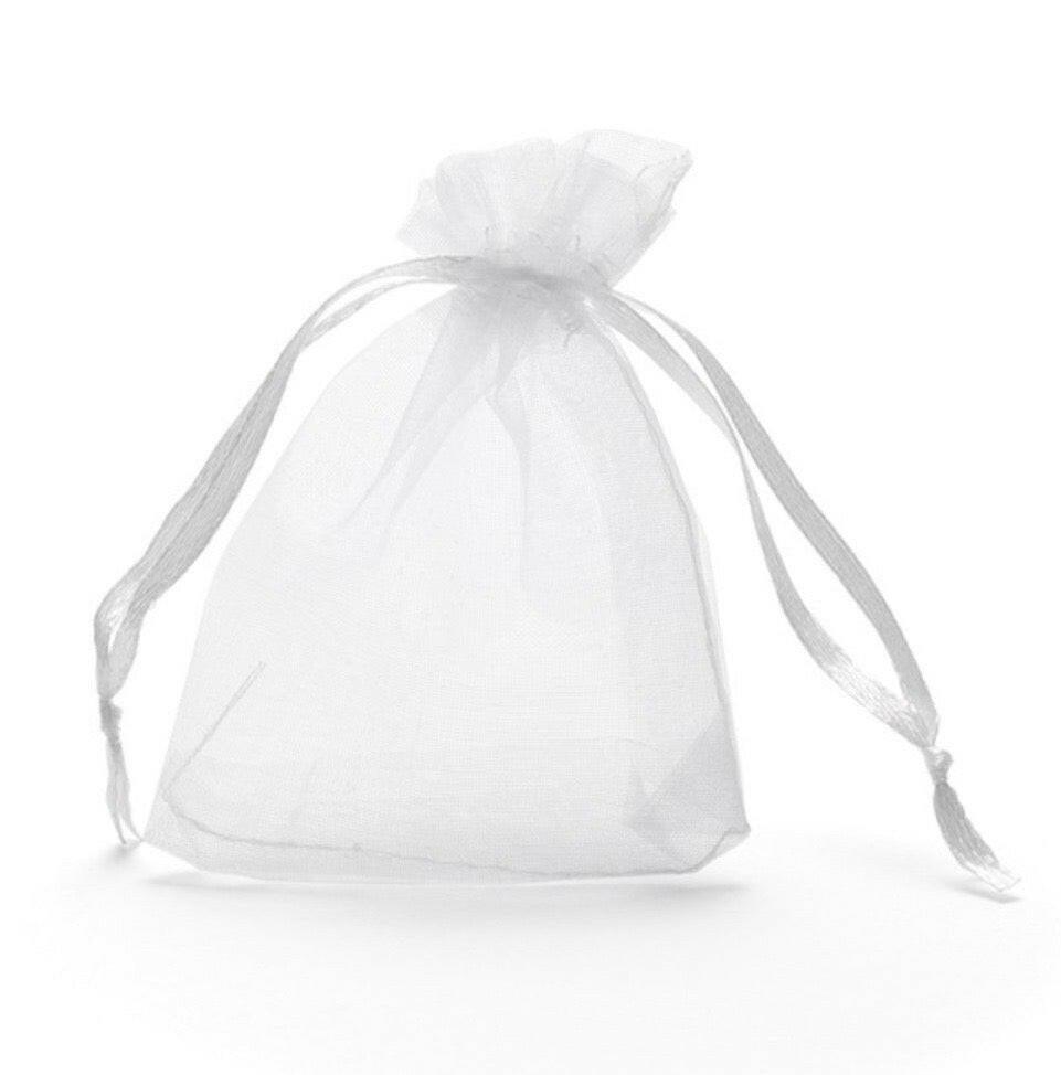 A white, transparent bag with a ribbon tied around it, sitting on a white background.