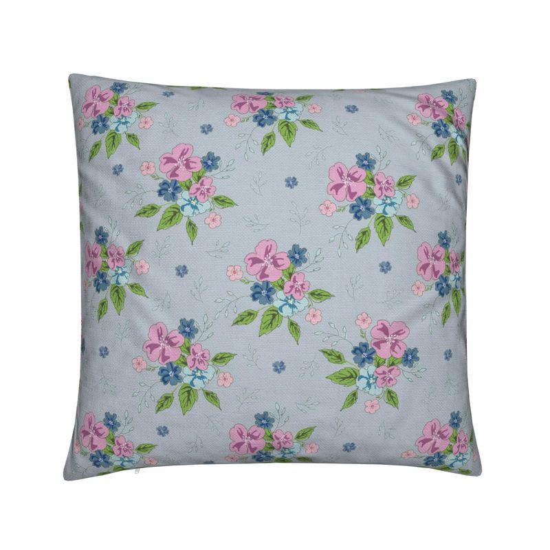 Square cushion with light blue fabric and pink floral pattern with green leaves