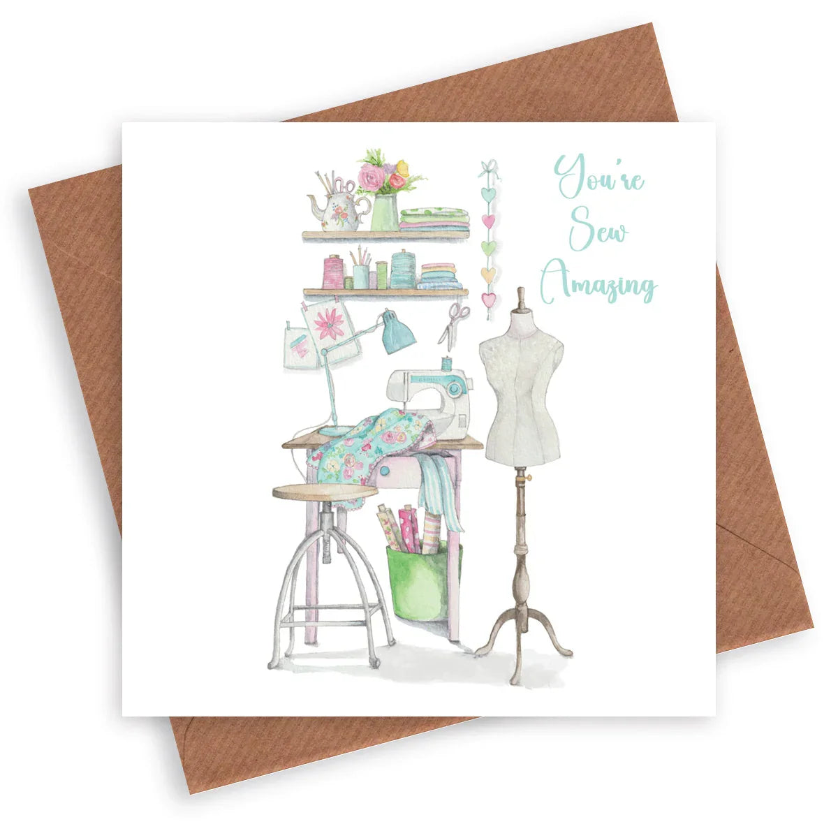 Handcrafted greeting card with sewing machine, dress form, and 'You're Sew Amazing' text