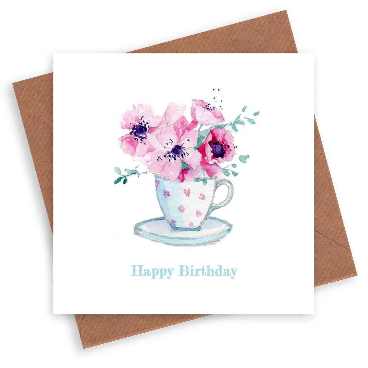 Birthday card with watercolor pink flowers in a teacup, kraft envelope behind