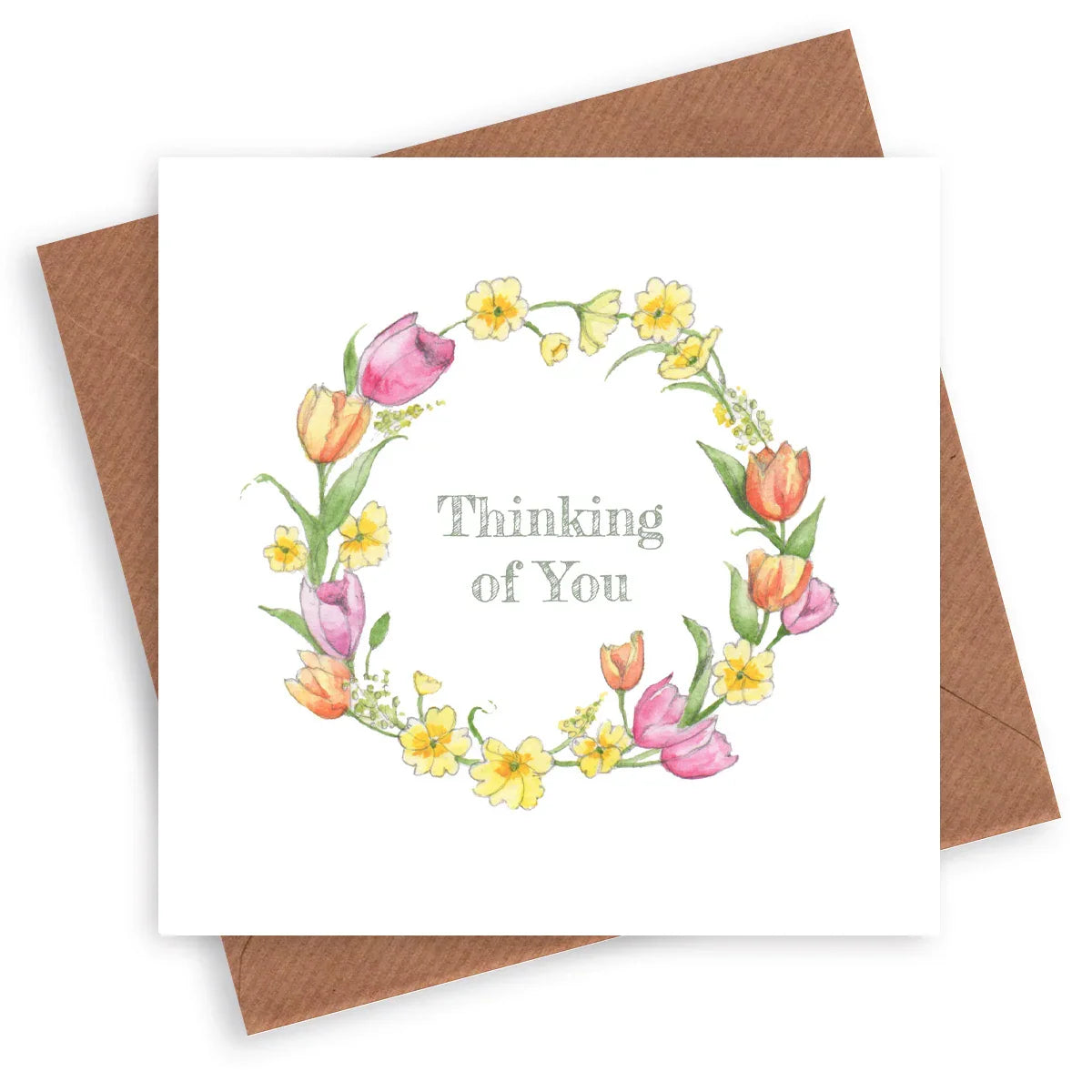 Thinking of You greeting card with watercolor floral wreath and brown envelope