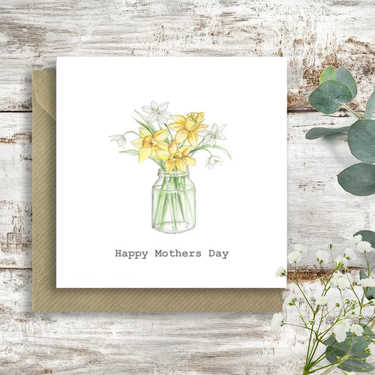 Handcrafted Happy Mothers Day card with illustrated daffodils in a glass jar on rustic wood