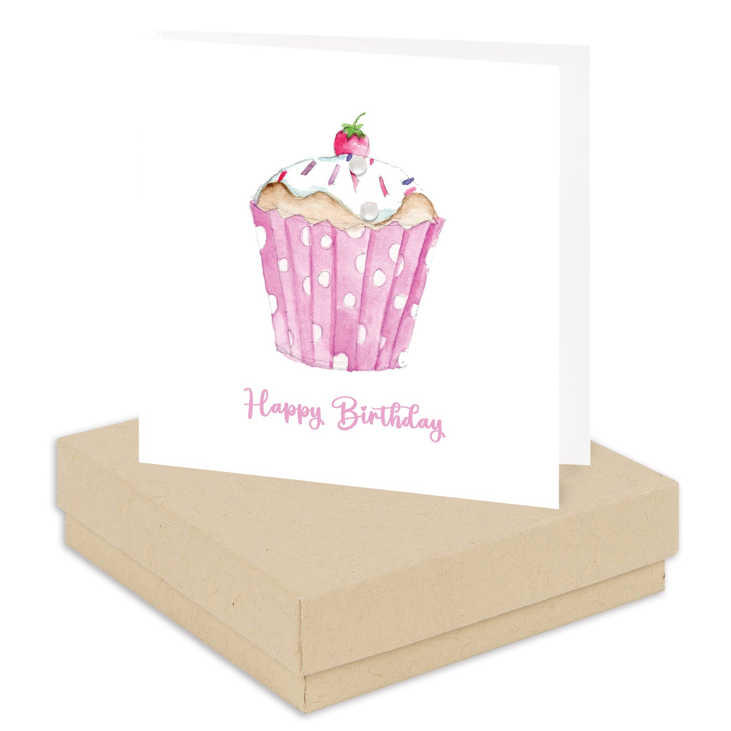 A square birthday card with a watercolor illustration of a pink polka-dotted cupcake and the words 'Happy Birthday' in pink script, displayed on top of a kraft paper gift box against a white background.