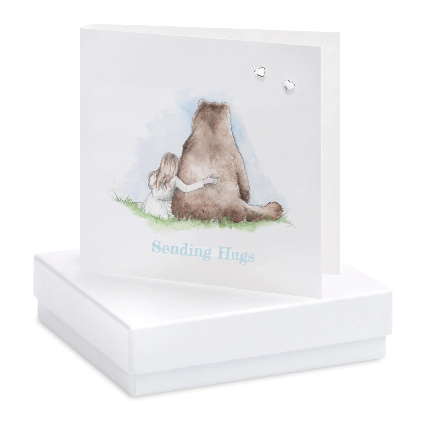 Greeting card with girl hugging bear illustration, 'Sending Hugs' text, and silver heart earrings