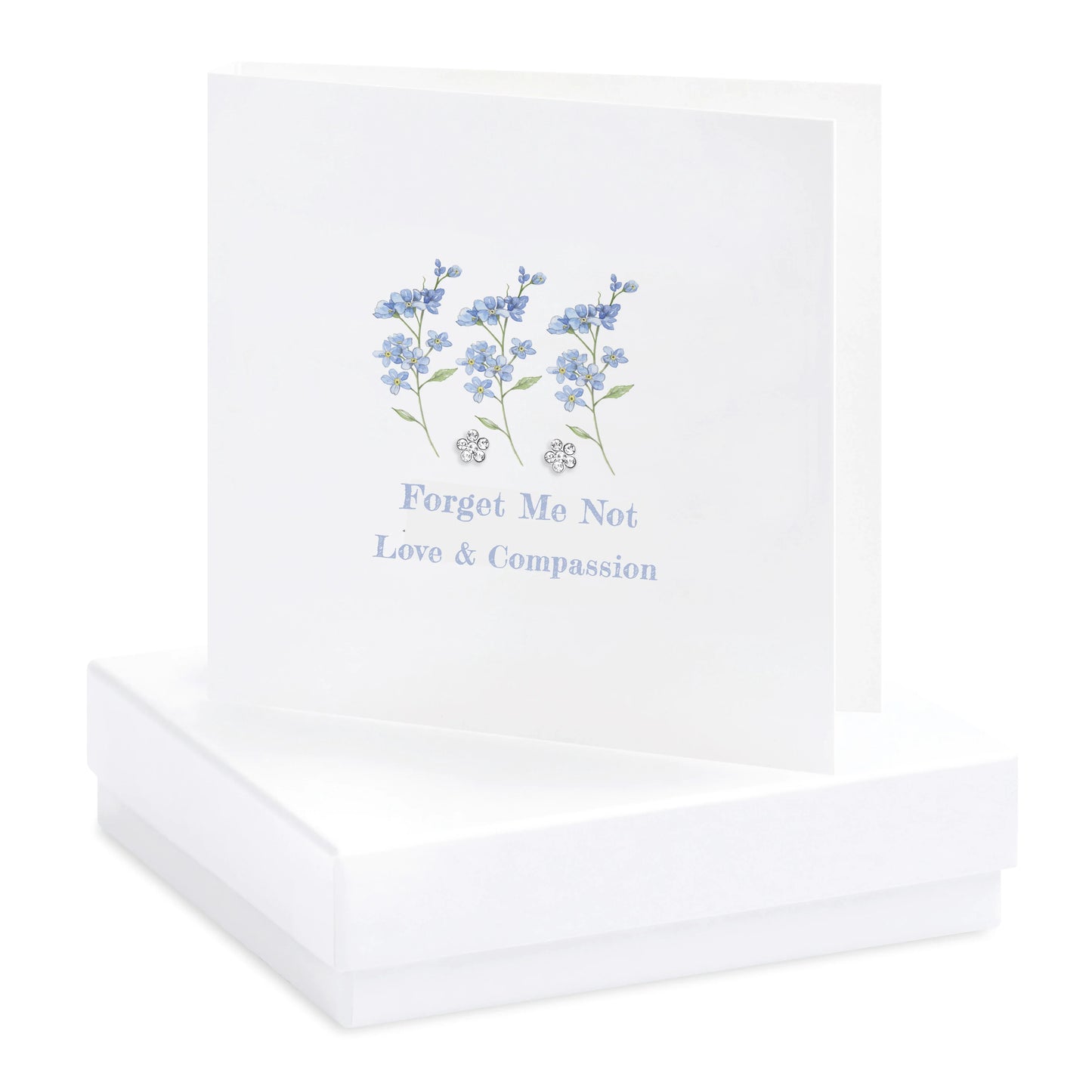 Handcrafted greeting card with blue forget-me-not flowers and 'Love & Compassion' text on gift box