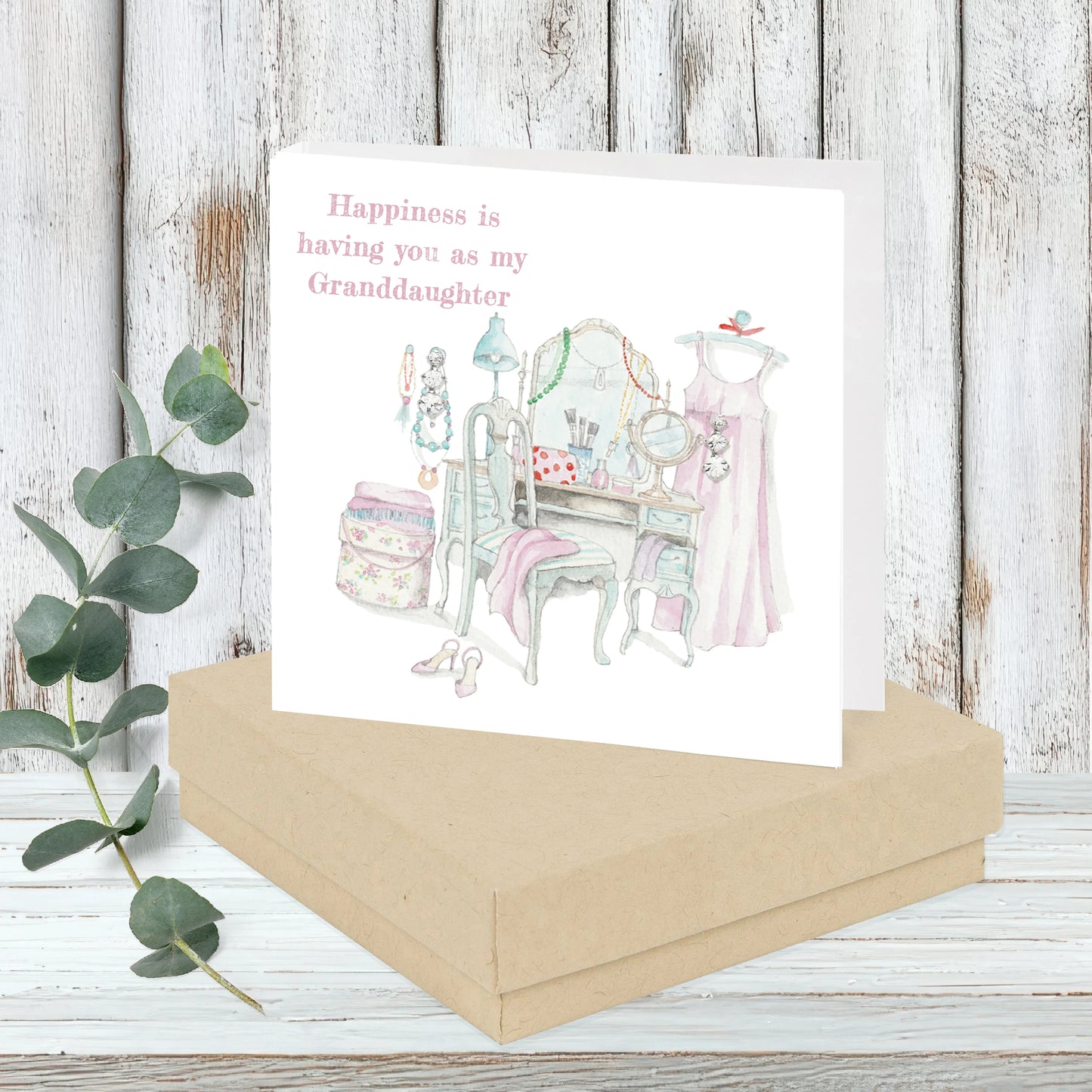 Granddaughter greeting card with vintage dressing table, pink dress, and floral gift box
